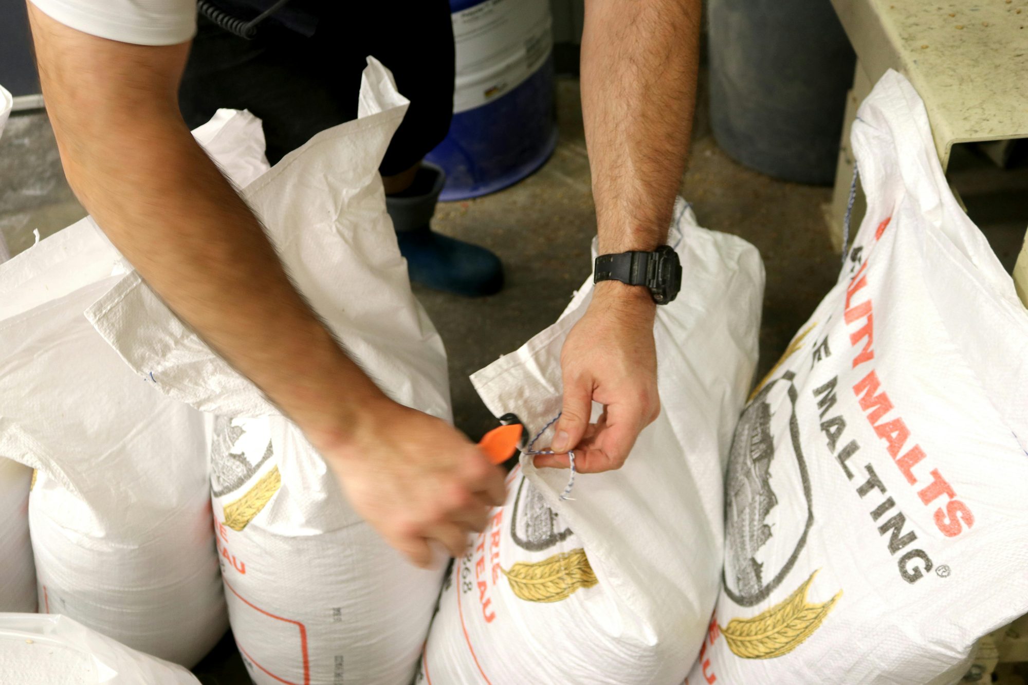 Stacked grain bags in craft brewery storage and purchasing workflow